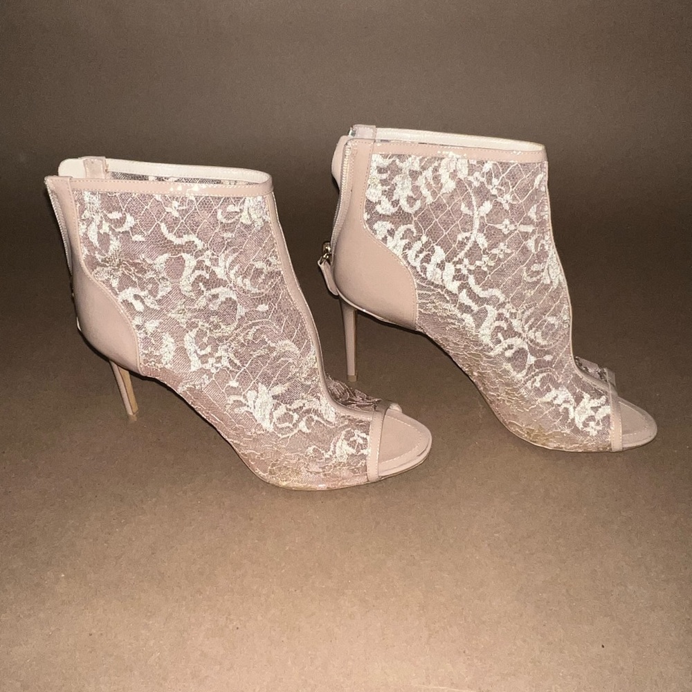 NICHOLAS KIRKWOOD Lace peep toe booties.